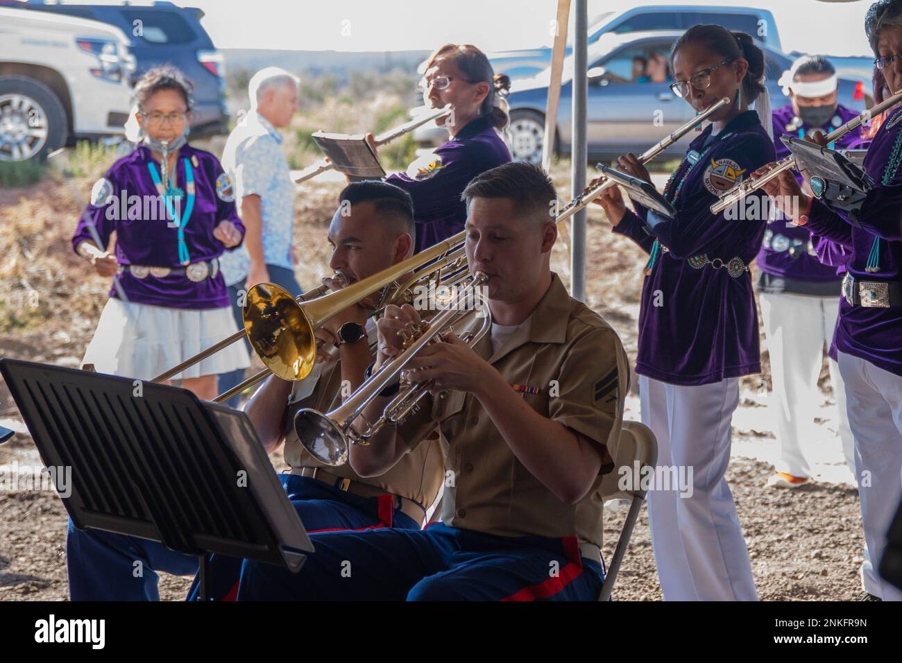 The Marine Forces Reserve Band performs alongside the Navajo Nation Band during the 80th anniversary of the founding of the Navajo Code Talkers at Tse Bonito, N.M., Aug. 14, 2022. The Marine Corps is supporting the 80th anniversary of the  founding of the Navajo Code Talkers and the vital role they played in the Pacific Island Hopping Campaign of World War II. Stock Photo