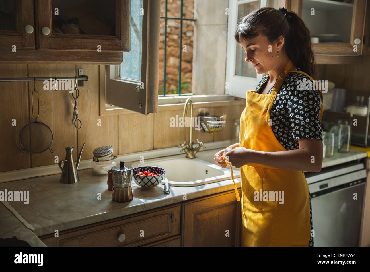 Woman in apron standing hi-res stock photography and images - Alamy