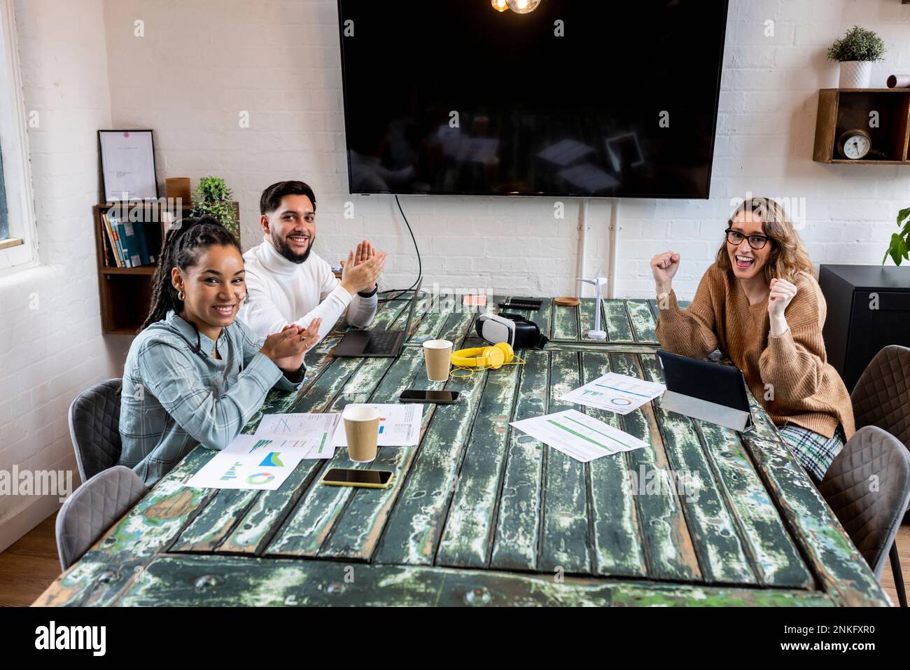 Happy business people sitting in meeting room at office Stock Photo Alamy