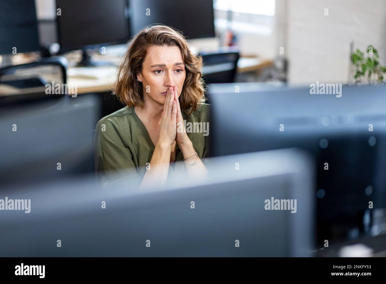 Stressed businesswoman sitting office hi-res stock photography and ...