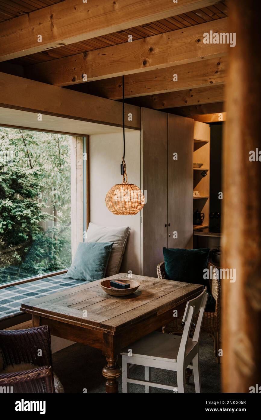 Pendant light hanging above table in farmhouse Stock Photo Alamy