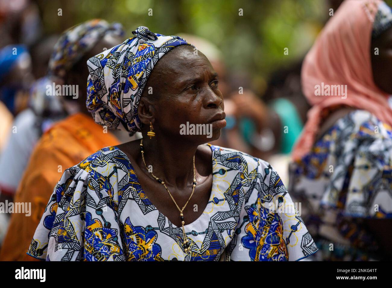 Agboville, Ivory Coast. 23rd Feb, 2023. A harvest worker sits on a cocoa plantation. Federal Minister of Labor Heil and Federal Minister for Economic Cooperation and Development Schulze visit Ghana and Côte d'Ivoire. Credit: Christophe Gateau/dpa/Alamy Live News Stock Photo