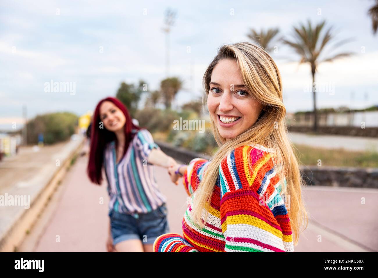 Holding hands on the promenade hi-res stock photography and images - Alamy