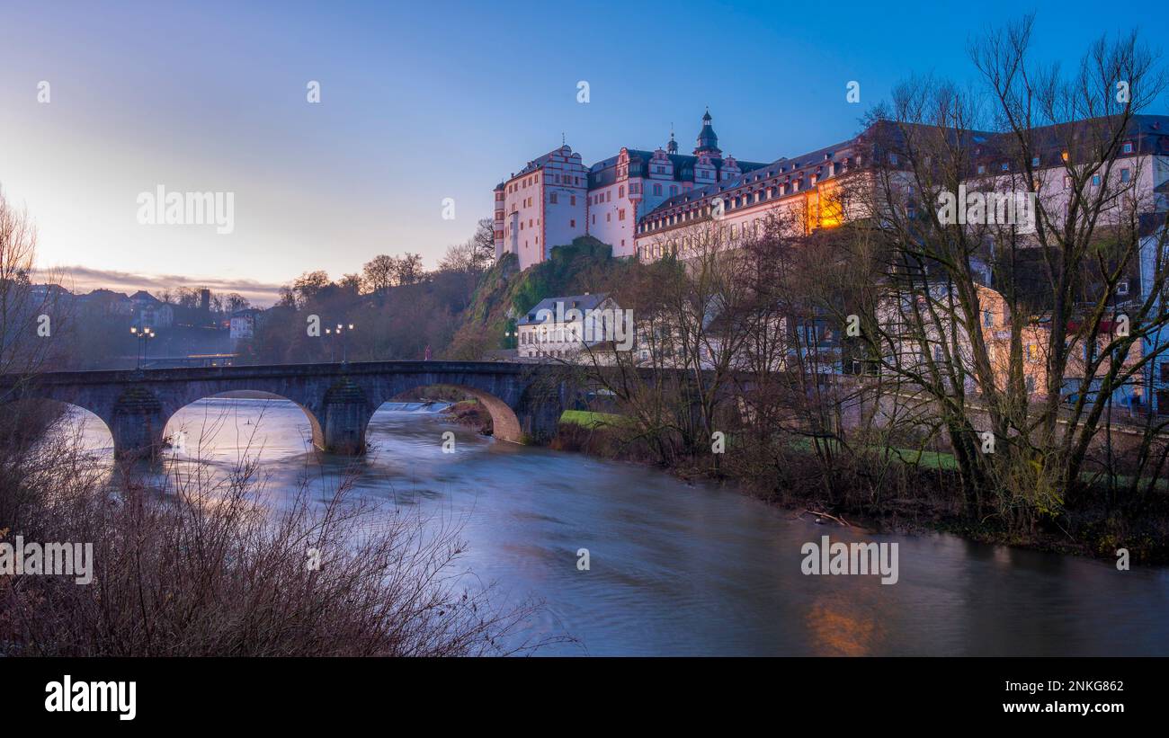 River in front of Weilburg Castle at sunrise Stock Photo