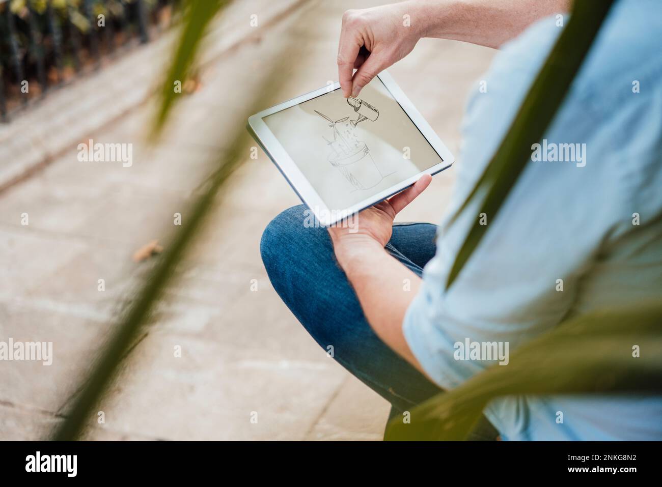 Mature man gesturing on drawing and using tablet PC Stock Photo