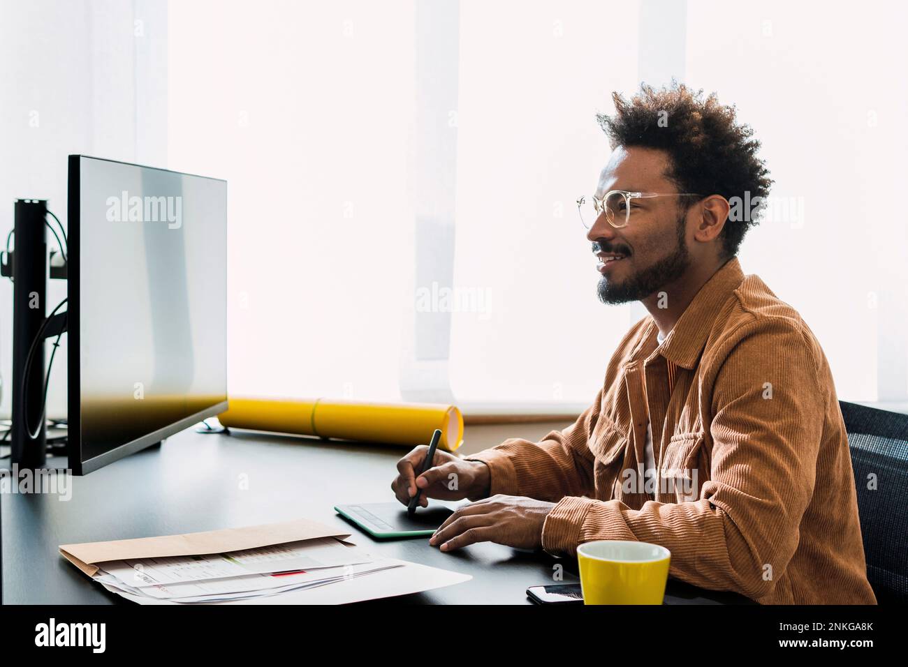 Creative people using desktop smiling hi-res stock photography and ...