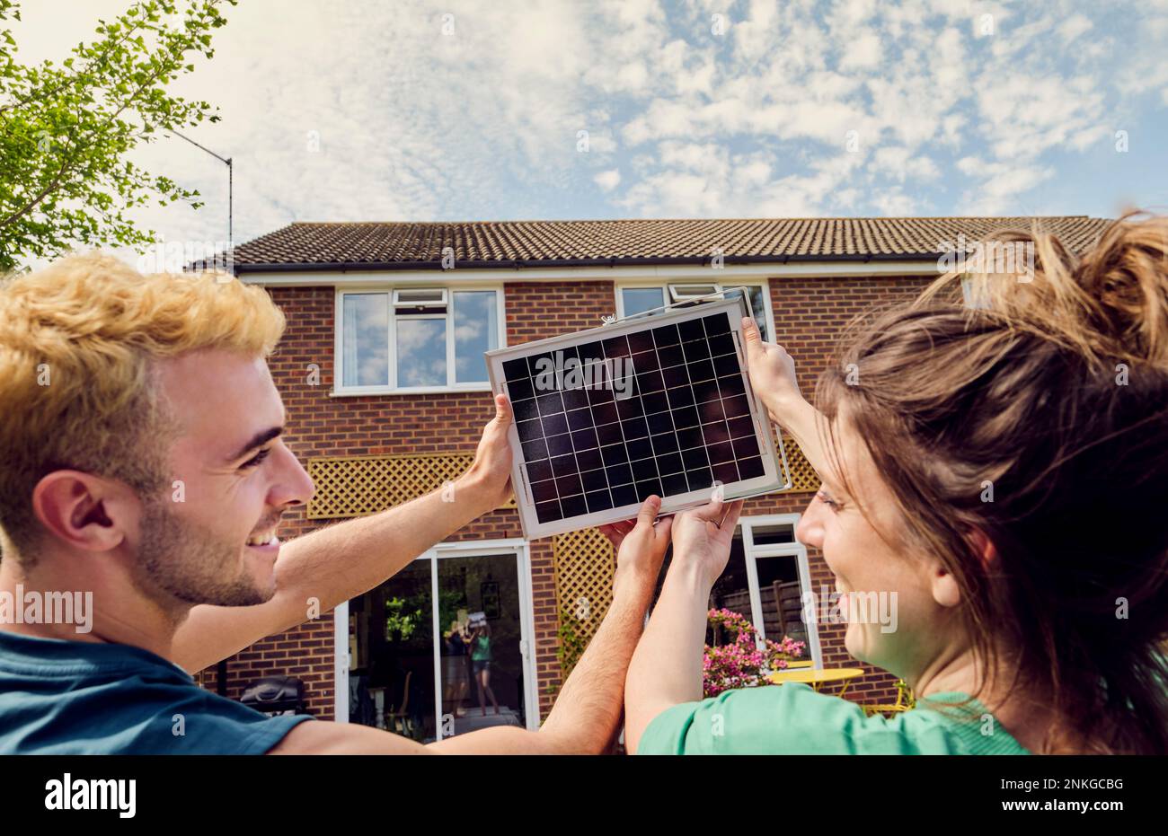 Couple in front solar panel hi-res stock photography and images - Alamy