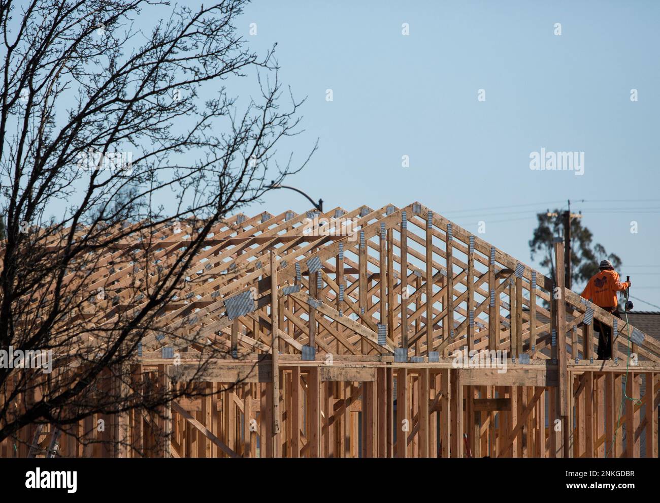 Construction workers rebuild a home destroyed by the Tubbs Fire in the