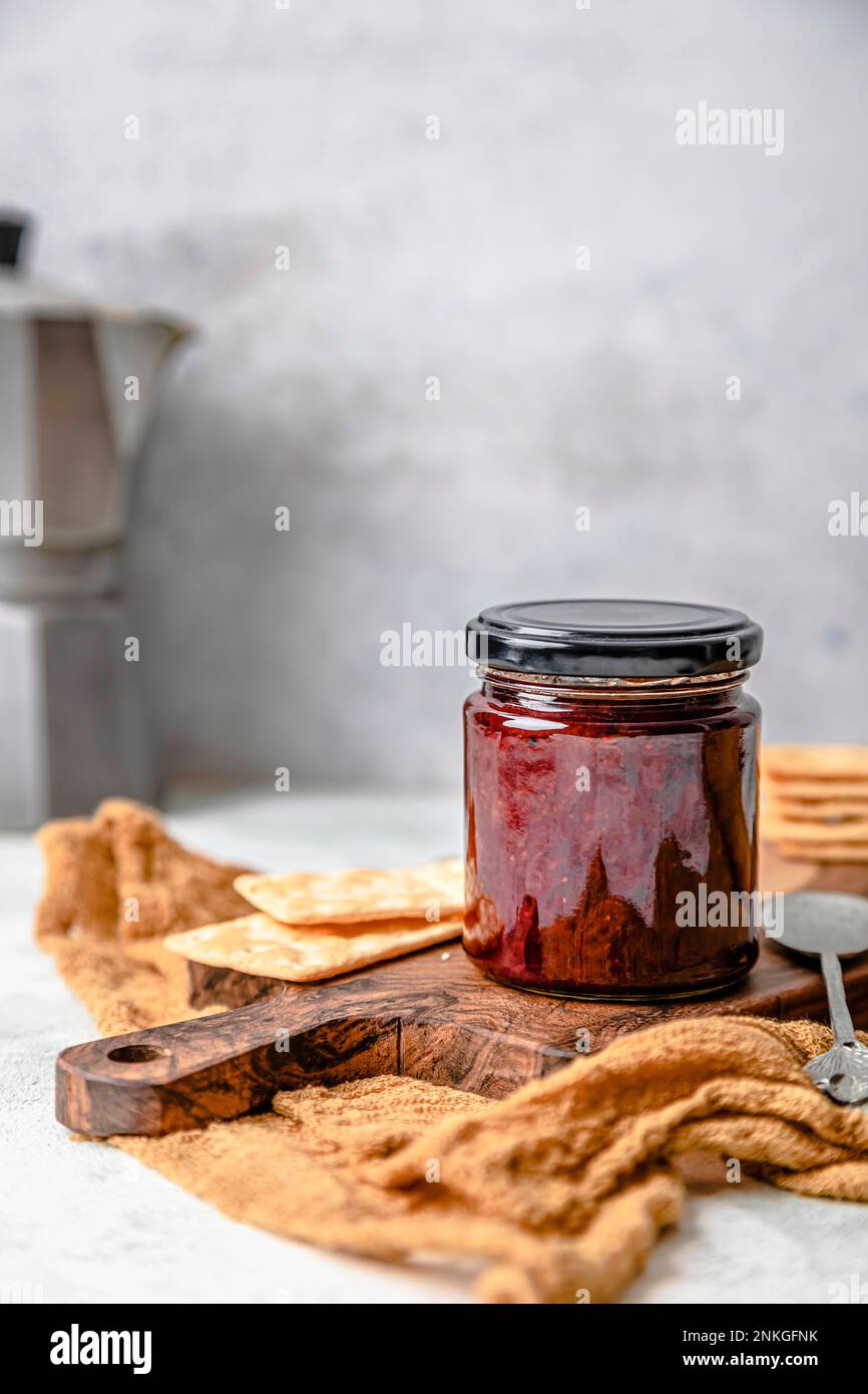 Homemade strawberry jam in jar with crackers Stock Photo Alamy