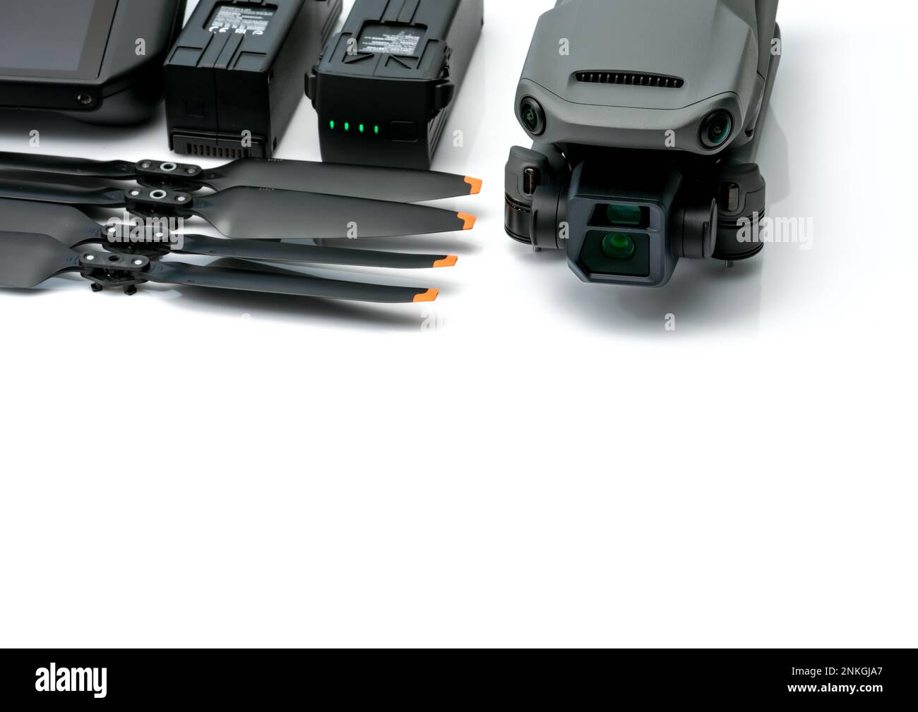 Drone and propeller blades on blur drone LiPo rechargeable battery. UAV