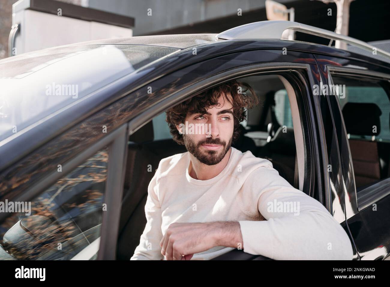 Thoughtful young man sitting in car Stock Photo