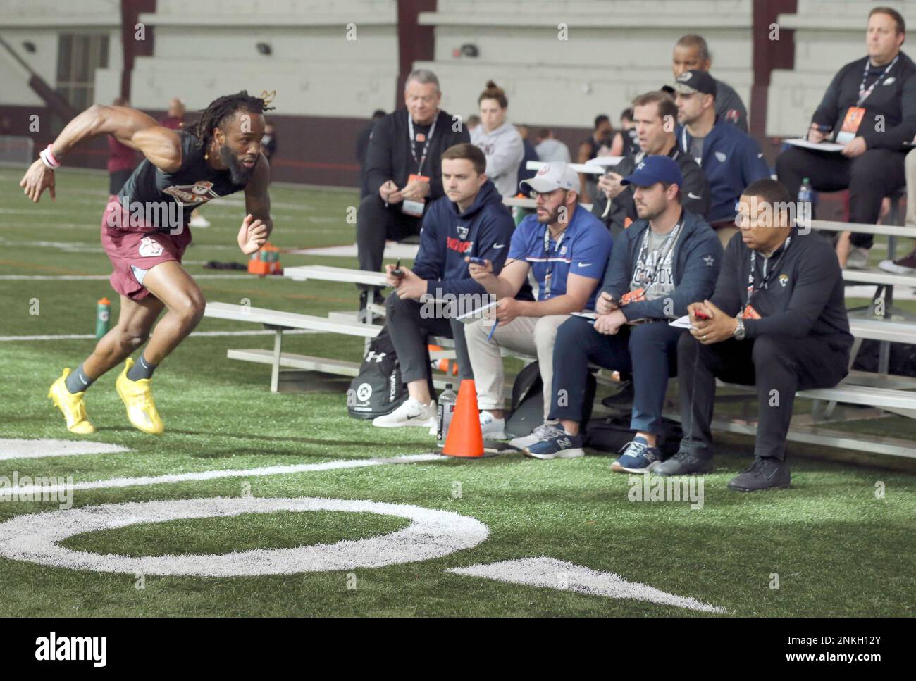 Wide receiver Tre Turner, left, crosses the finishing line while running a  20 yard shuttle runduring Virginia Tech's pro football day for NFL scouts  and coaches, Tuesday, March 22, 2022, in Blacksburg,