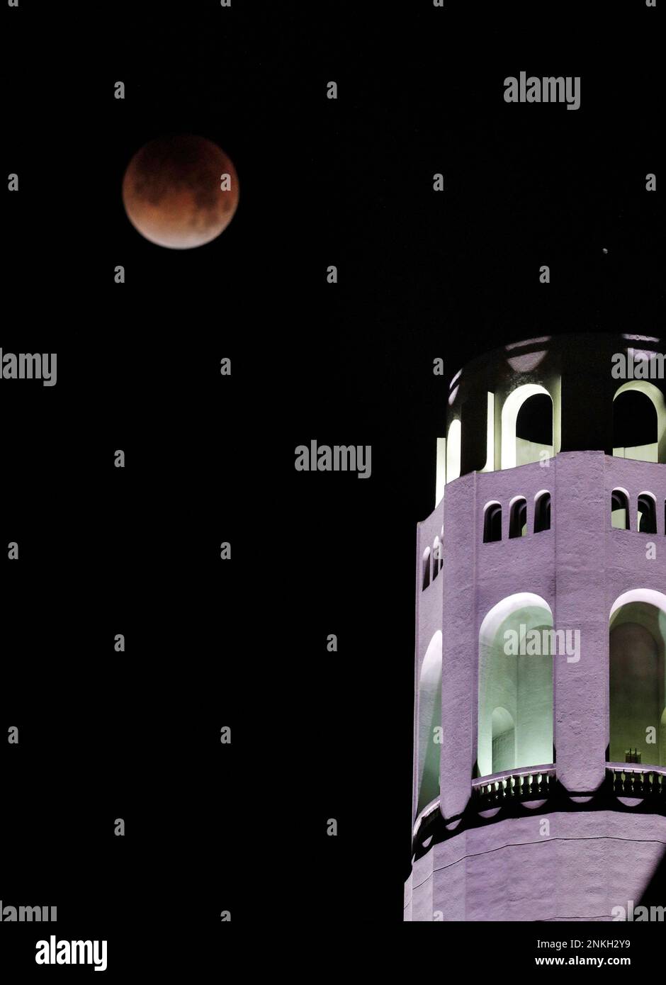 The Super Blue Blood Moon makes its way past Coit Tower in San ...