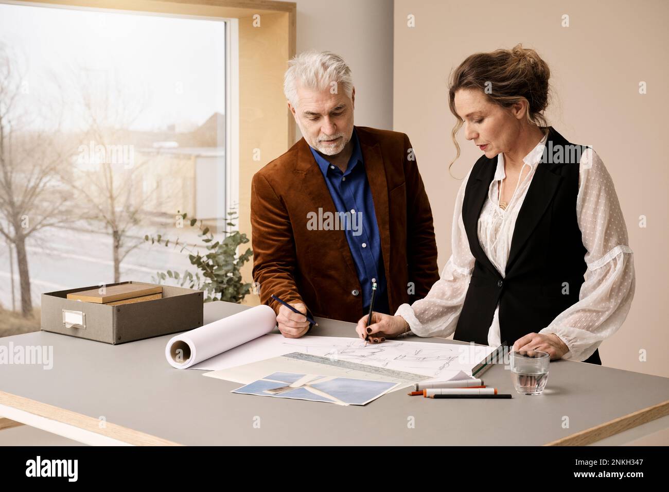 Mature fashion designers working together in studio Stock Photo