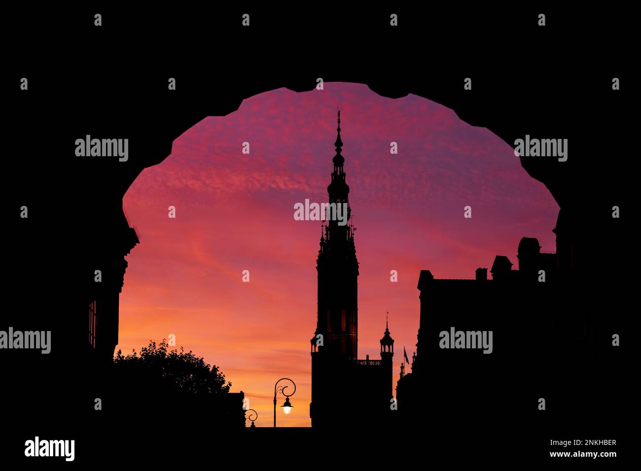 Silhouette of Town Hall Tower and arch of Green Gate at dusk Stock