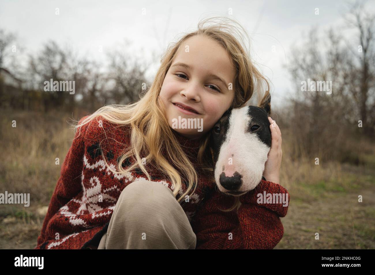 Cute smiling girl with dog Stock Photo - Alamy