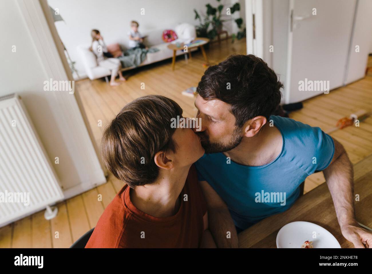 Mature romantic couple kissing each other at home Stock Photo