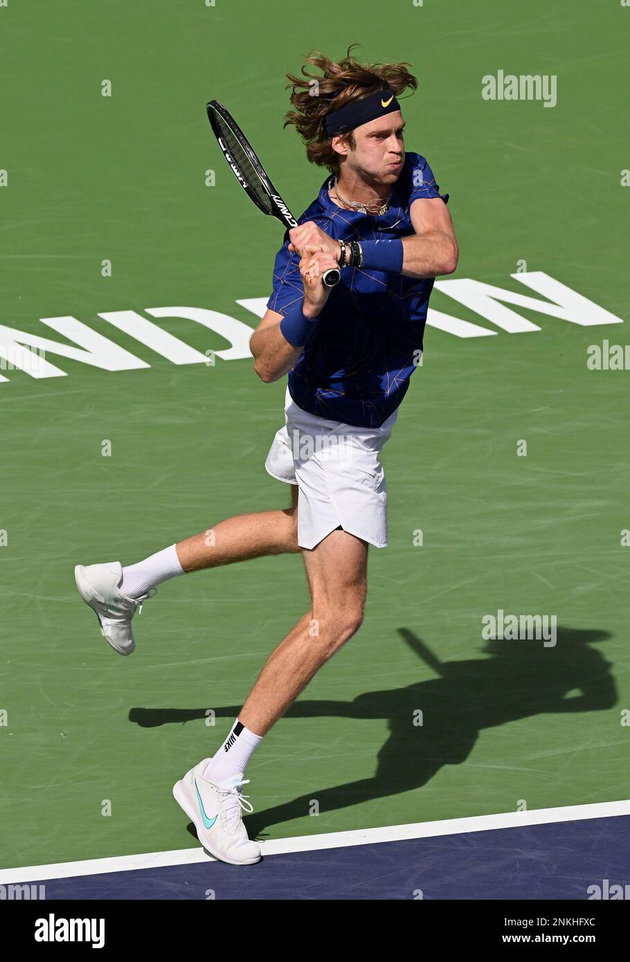 INDIAN WELLS, CA - MARCH 19: Andrey Rublev of Russia in the air after ...