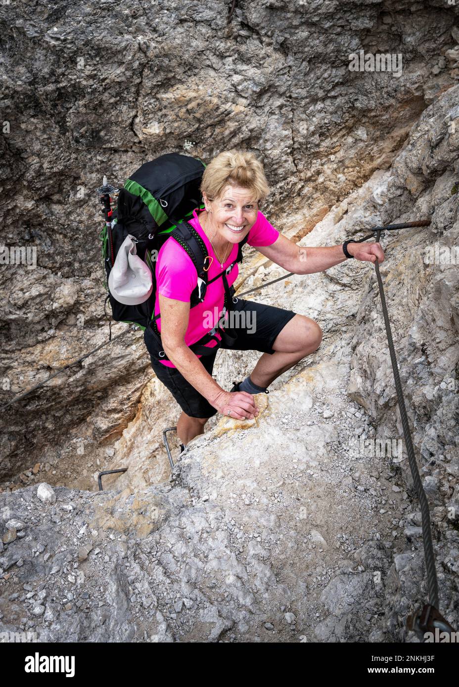 Active senior woman climbing rock Stock Photo Alamy