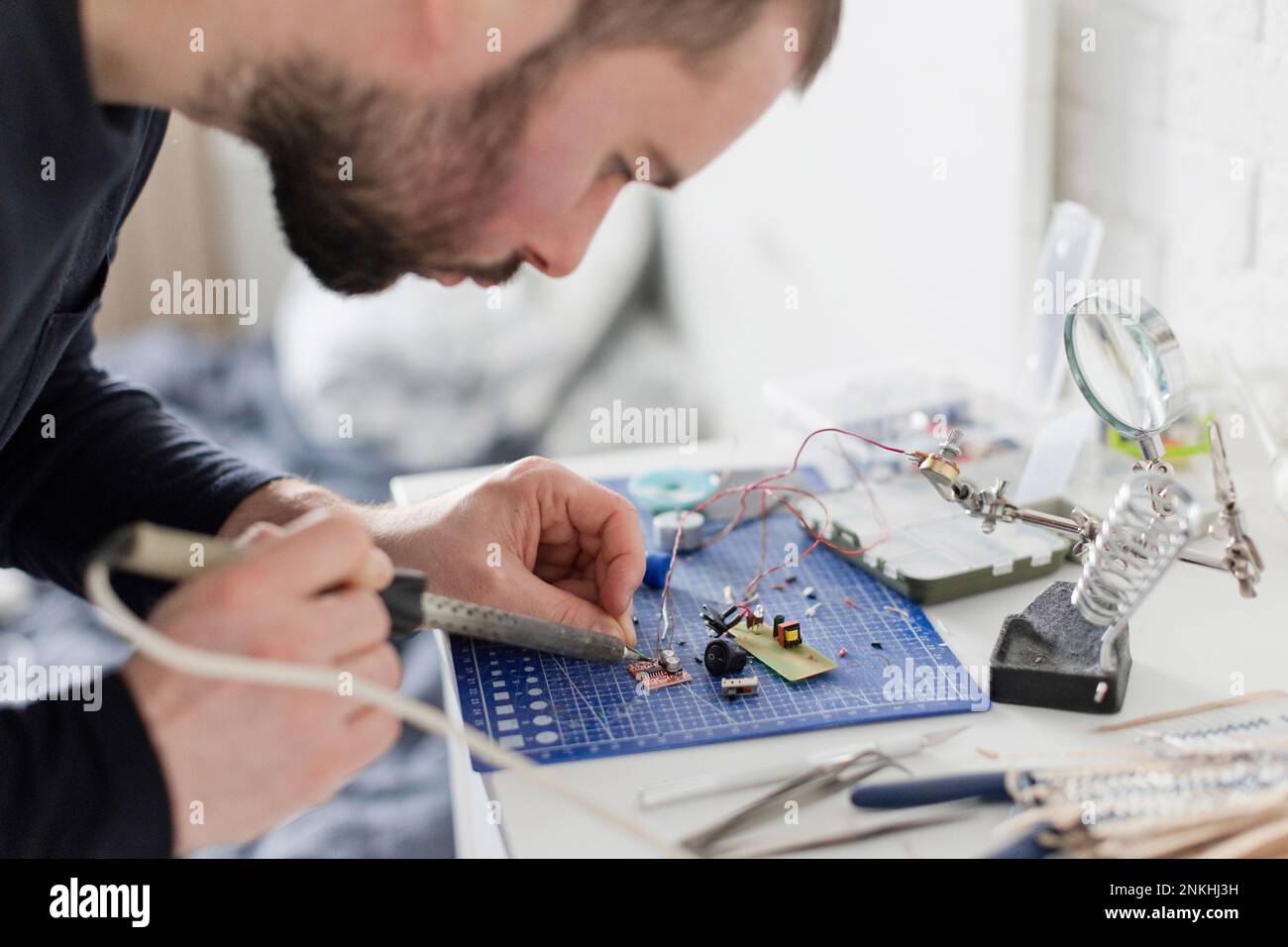 Engineer soldering circuit board at Stock Photo Alamy
