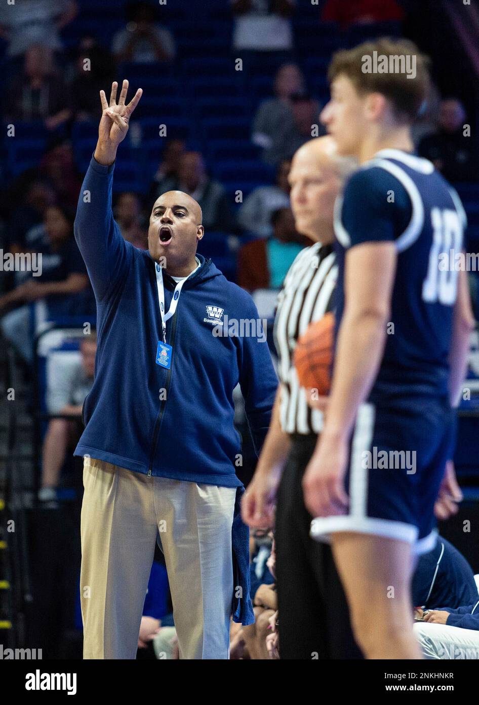 Warren Central head coach William Unseld, left, shouts instructions