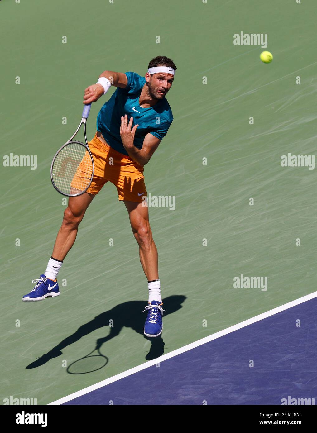 March 18, 2022 Grigor Dimitrov of Bulgaria serves against Andrey Rublev of Russia in their quarterfinal match of the 2022 BNP Paribas Open at Indian Wells Tennis Garden in Indian Wells, California.