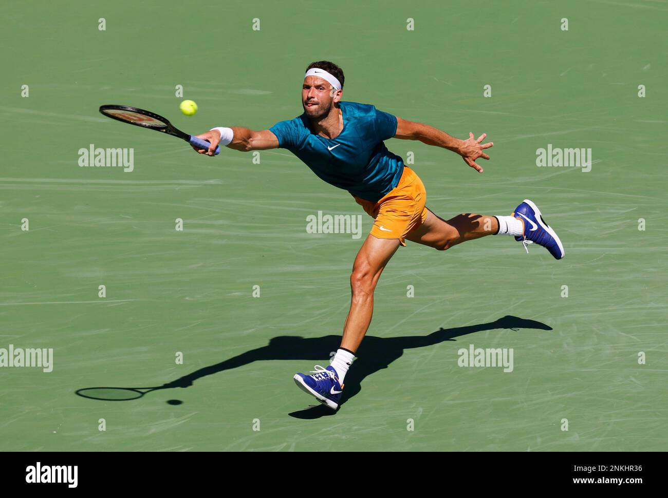 March 18, 2022 Grigor Dimitrov of Bulgaria returns a shot against Andrey Rublev of Russia in their quarterfinal match of the 2022 BNP Paribas Open at Indian Wells Tennis Garden in Indian