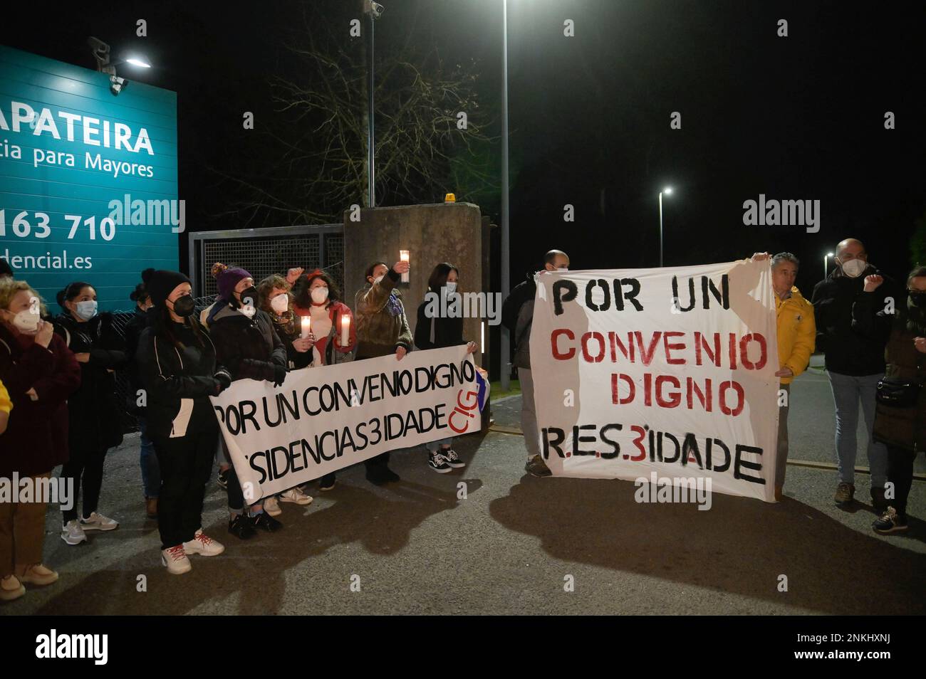 A group of staff from the Caser de A Zapateira nursing home committee take  part in a rally in front of the center on March 17, 2022, in Zapateira, A  Coruña, Galicia (