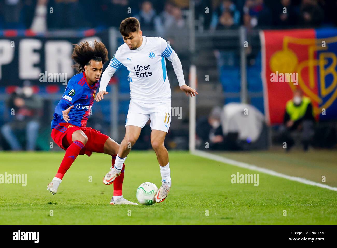 Basel's Tomas Tavares, left, fight for the ball against Marseille's Cengiz  Uender during the Europa Conference League round of 16 second leg soccer  match between Switzerland's FC Basel 1893 and France's Olympique