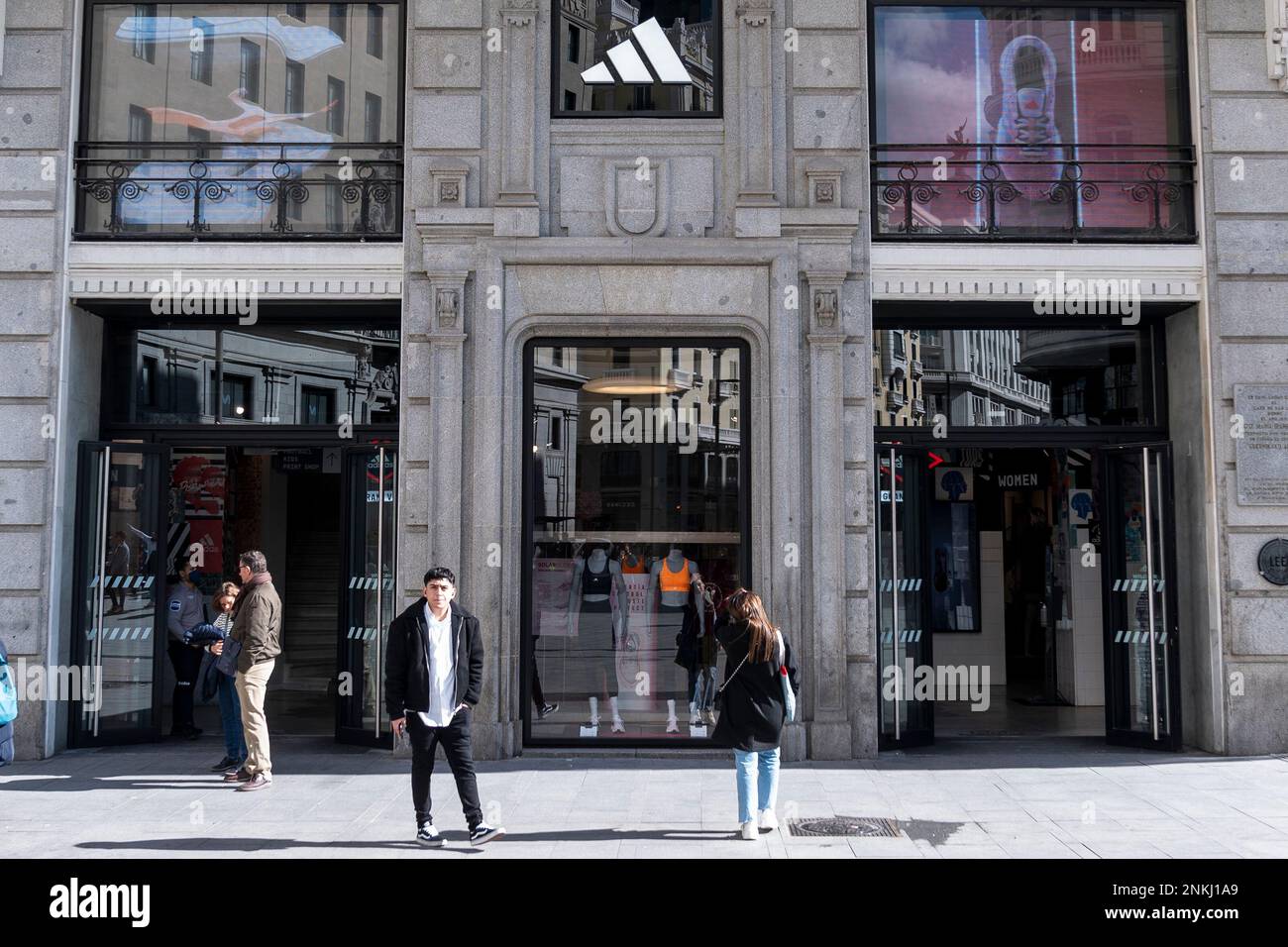 Several people in front of an Adidas store on March 5, 2022, in Madrid,  Spain. Several companies have closed their branches and stores in Russia  after it invaded Ukraine. Inditex announced the