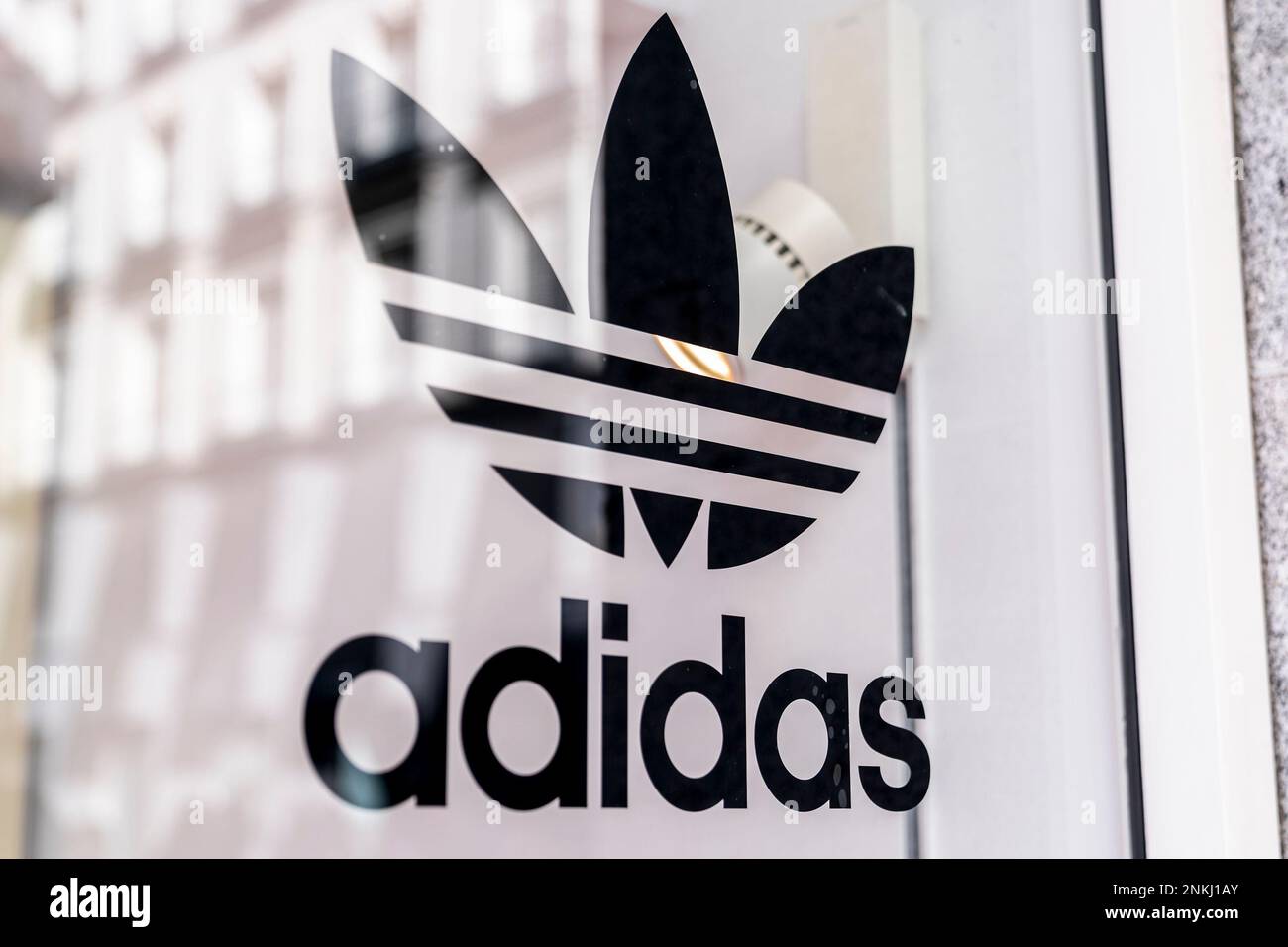 A sign on the window of an Adidas store, March 5, 2022, in Madrid, Spain.  Several companies have closed their branches and stores in Russia after it  invaded Ukraine. Inditex announced the
