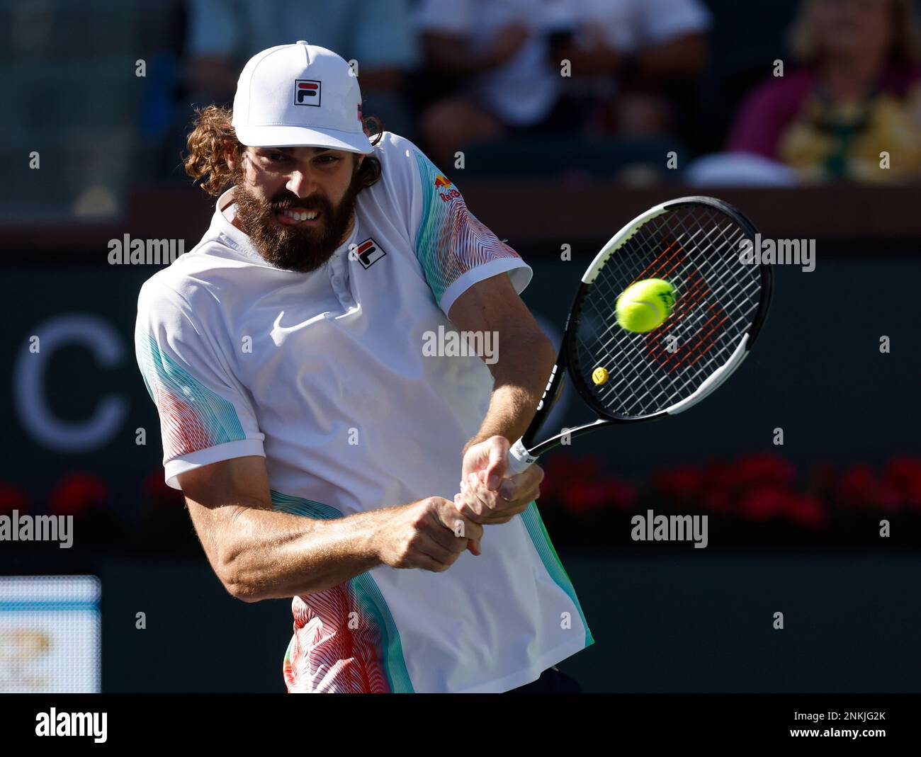 March 14, 2022 Reilly Opelka returns a shot against Denis Shapovalov of Canada during the 2022 BNP Paribas Open at Indian Wells Tennis Garden in Indian Wells, California