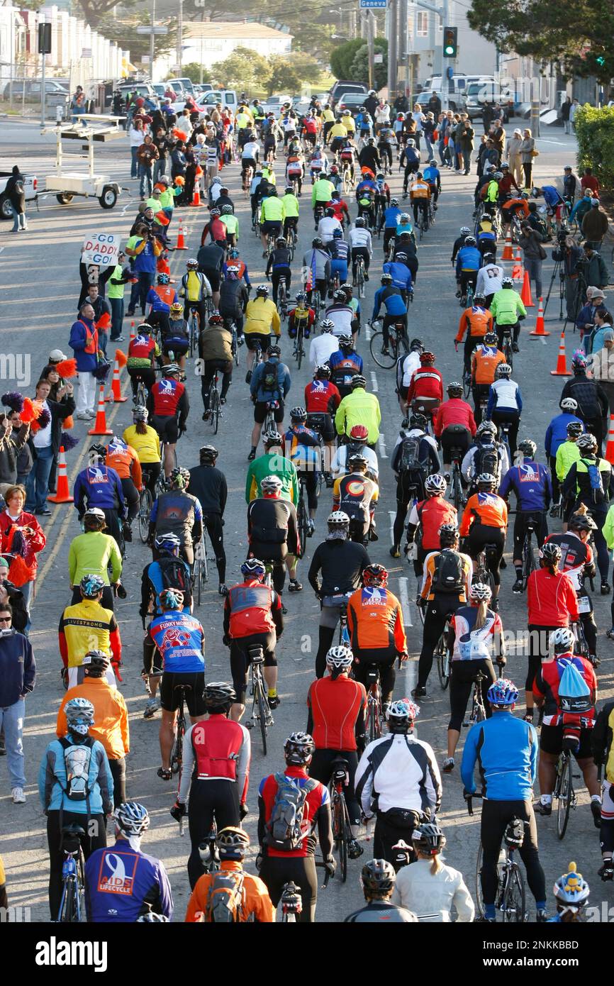 Supporters cheered and waved signs of support as the riders started ...