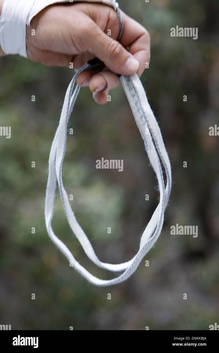 A sling is made of nylon woven into a flat tube an inch across. It is very  strong and unlike climbing rope, it does not stretch under tension. Part of  the equipment