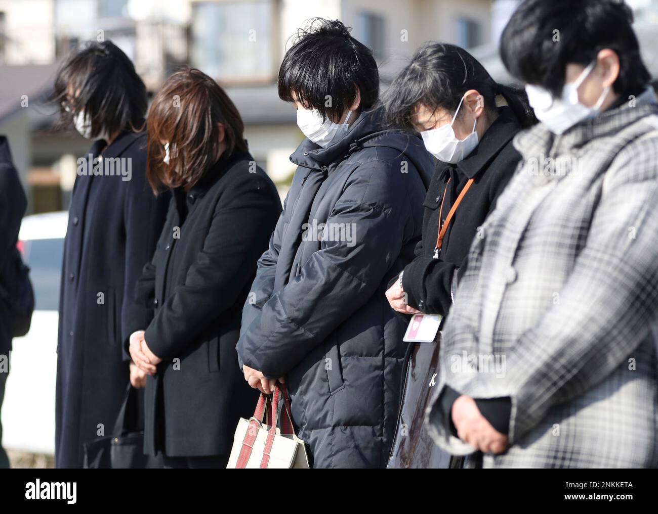 Memebers of NPO Celia Circle offer a moment of silence for the tsunami  victims in Watari, Miyagi Prefecture on March 10, 2022, one day prior to  the 11th annivesary of the 2011