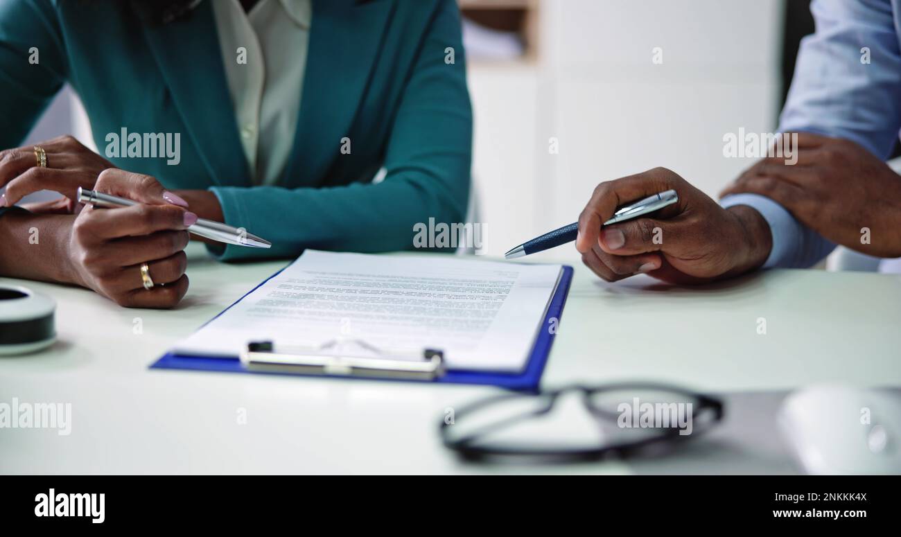 Lawyer Contract Mediation And Review. Two Reading Corporate Document Stock Photo