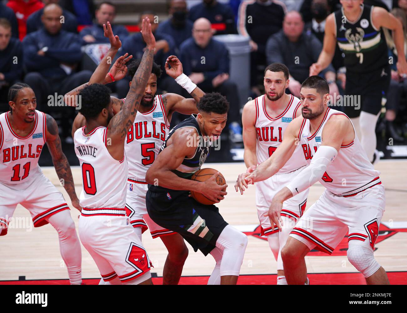 CHICAGO, IL - MARCH 04: Milwaukee Bucks forward Giannis Antetokounmpo (34)  tripled teamed by Chicago Bulls guard Coby White (0) Chicago Bulls forward  Derrick Jones Jr. (5) and Chicago Bulls center Nikola