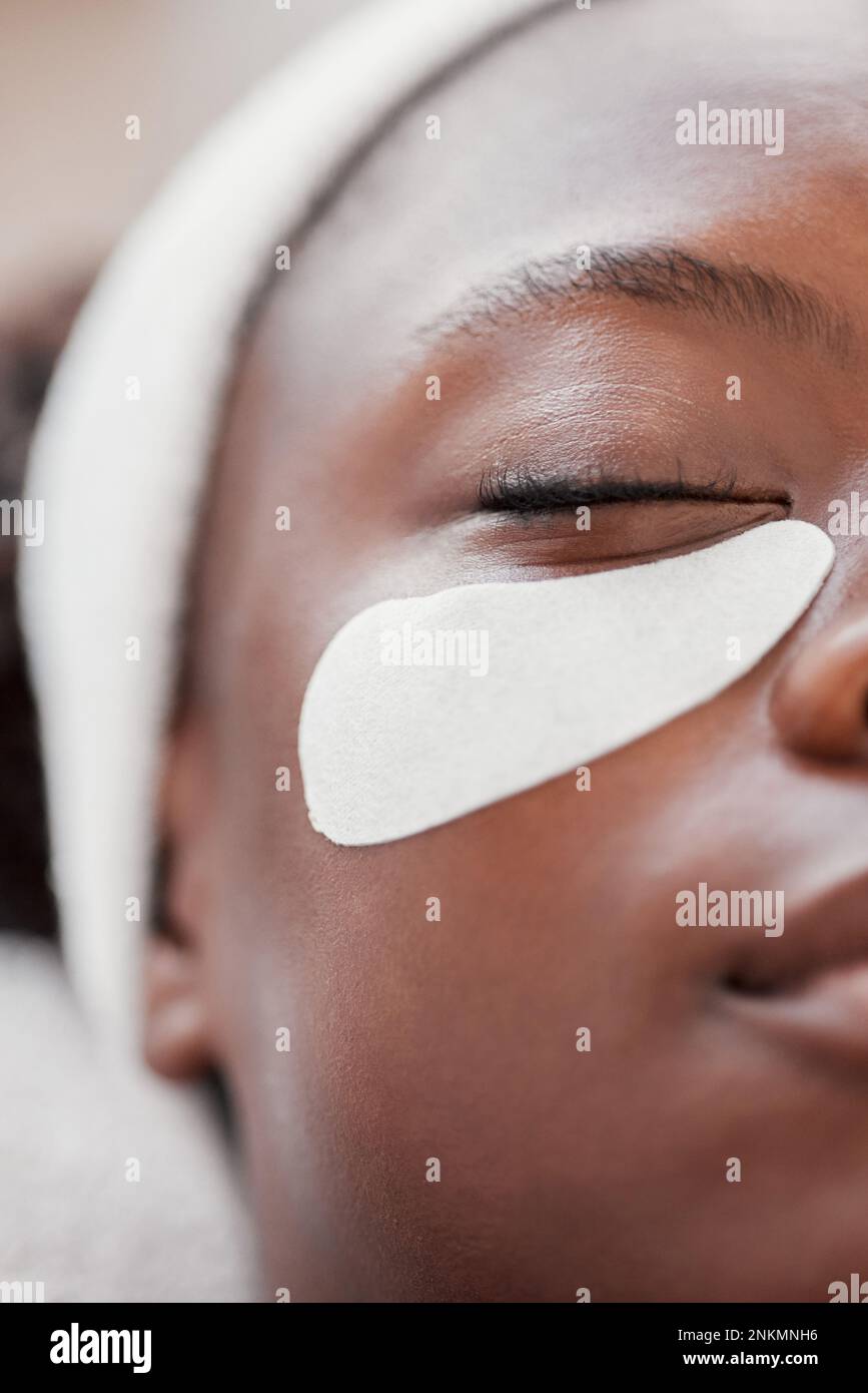 Closeup, cosmetics and black woman, eye patch and skincare for beauty 