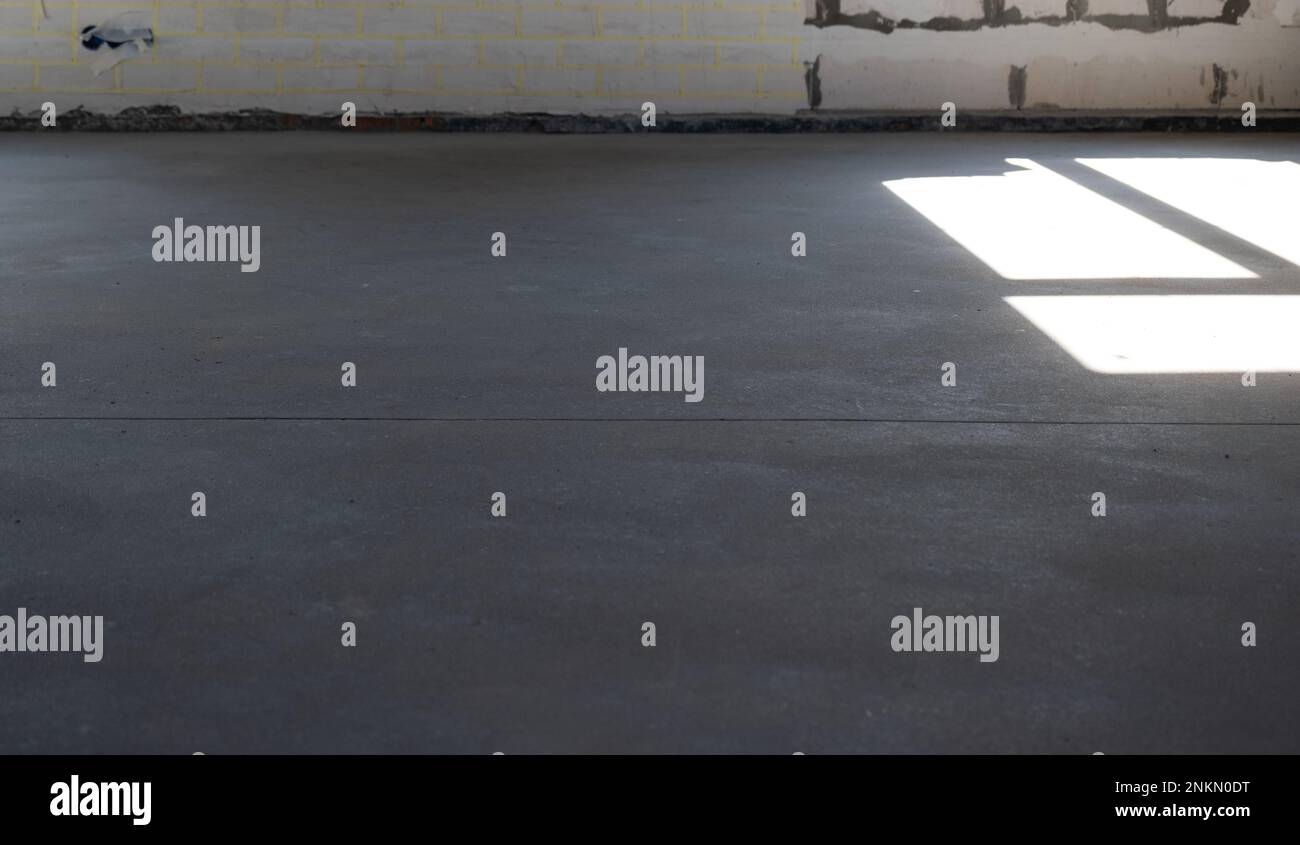 The leveled rough floor in a house under construction with a semidry