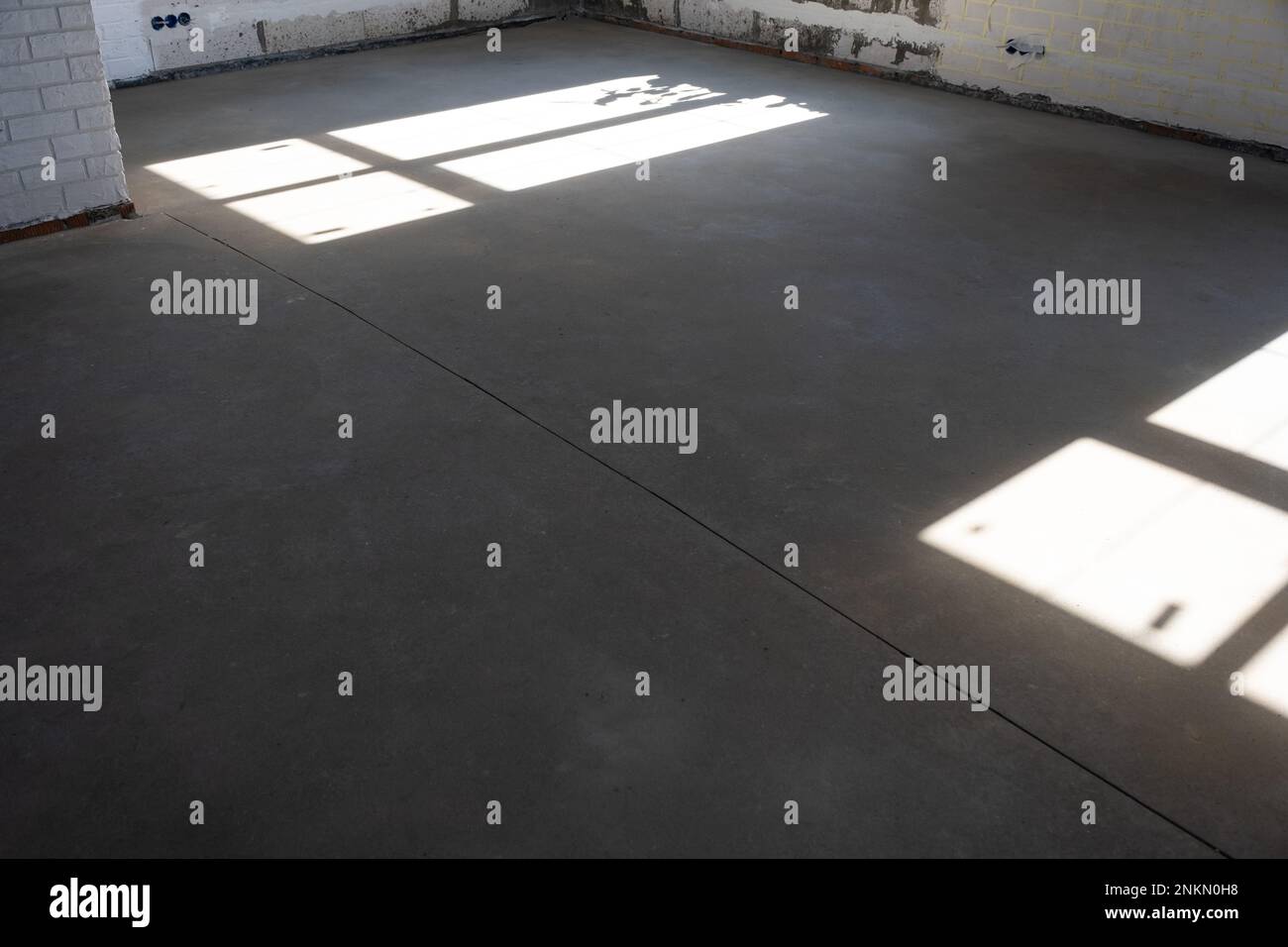The leveled rough floor in a house under construction with a semidry