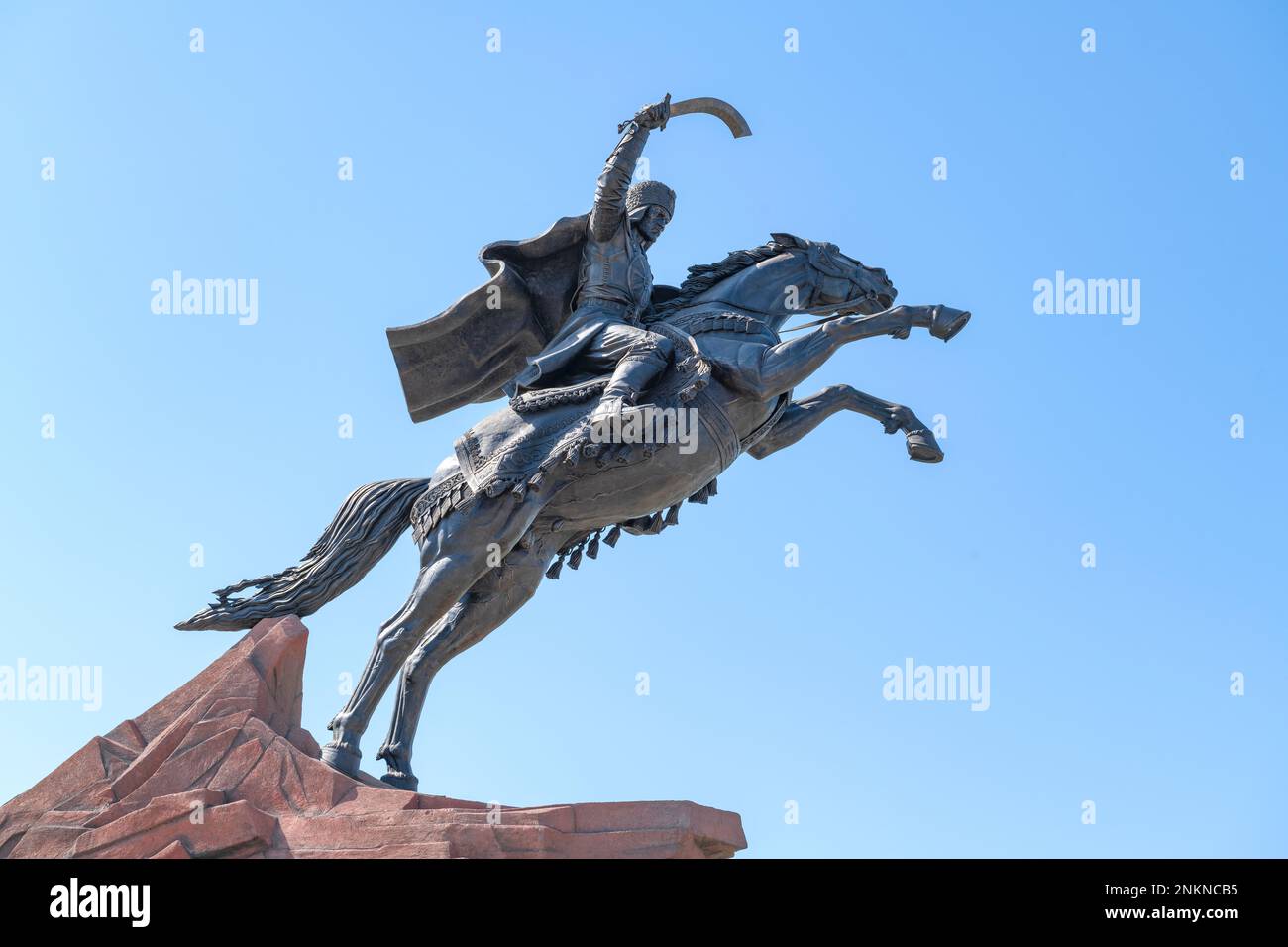 URGENCH, UZBEKISTAN - SEPTEMBER 07, 2022: Monument to the ruler and commander Jalal ad-Din Manguberdy against the background of a blue cloudless sky Stock Photo