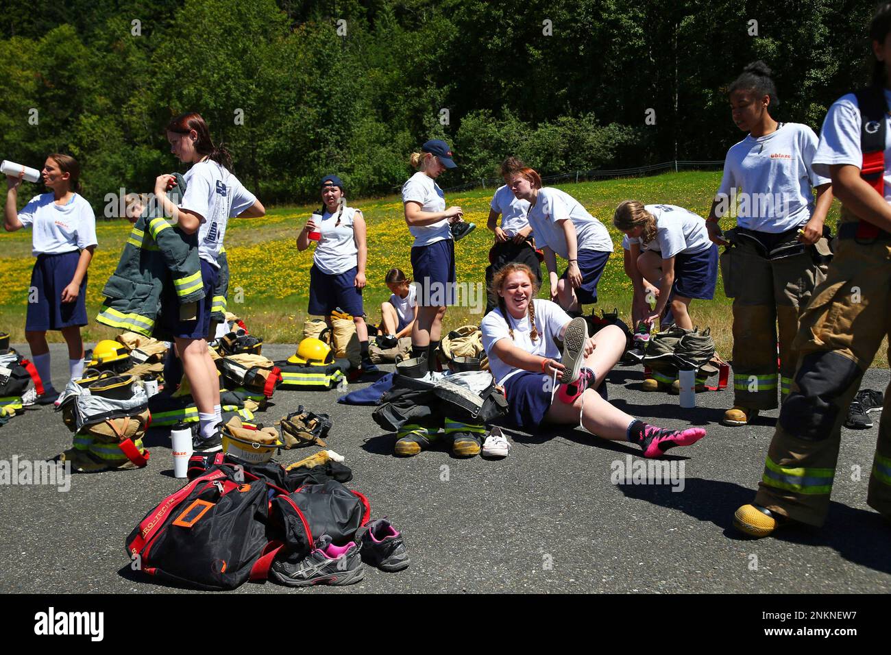 Firefighting Camp Campers take a break after a live fire drill at Camp Blaze, a ...