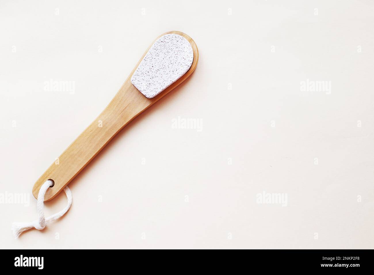 eco friendly foot pumice stone on beige background with copy space