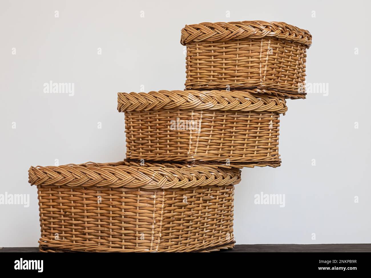products from a rod. wickerwork is a traditional folk craft. handmade. Stock Photo