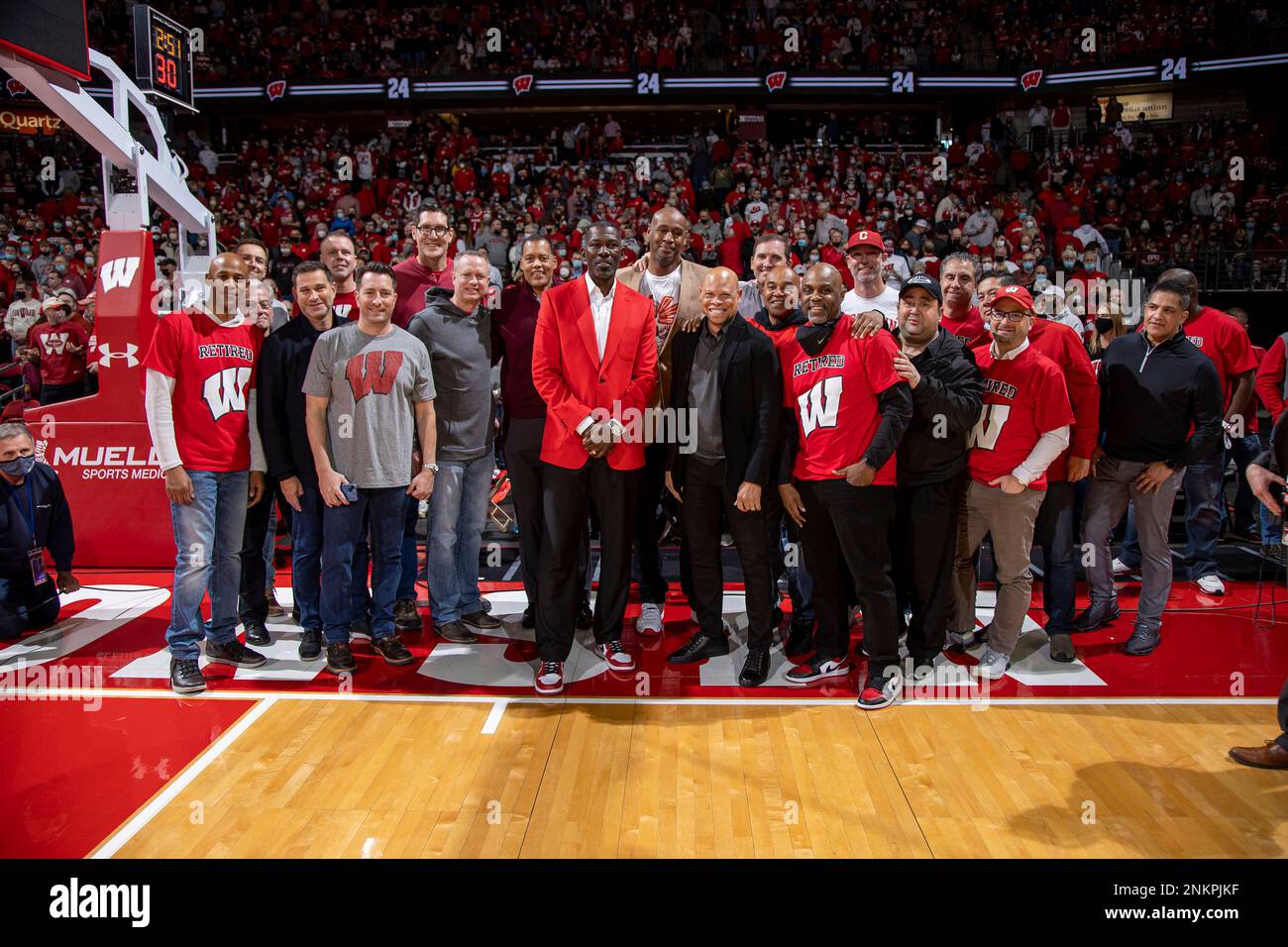 Former Wisconsin basketball player Michael Finley acknowledges the crowd  during a ceremony to retire his jersey number at halftime of an NCAA college  basketball game between Wisconsin and Michigan Sunday, Feb. 20