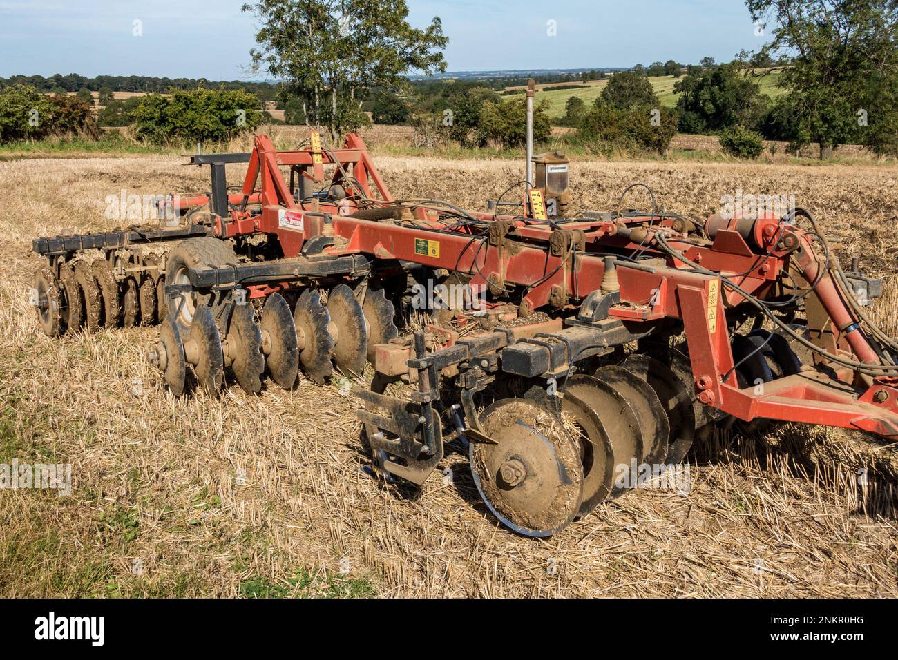 Gregoire Besson disk harrow cultivator parked in Leicestershire field of stubble, England, UK Stock Photo