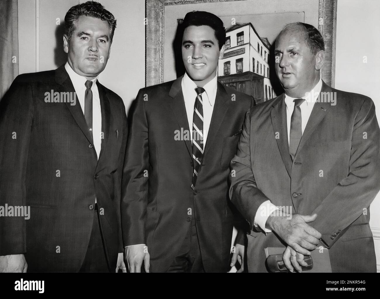 American icon, Elvis Presley with his father, Vernon Presley and manager, Colonel Tom Parker  (c 1962) Stock Photo