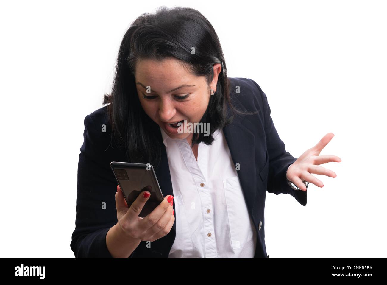 Upset businesswoman in office formalwear looking a smartphone screen ...