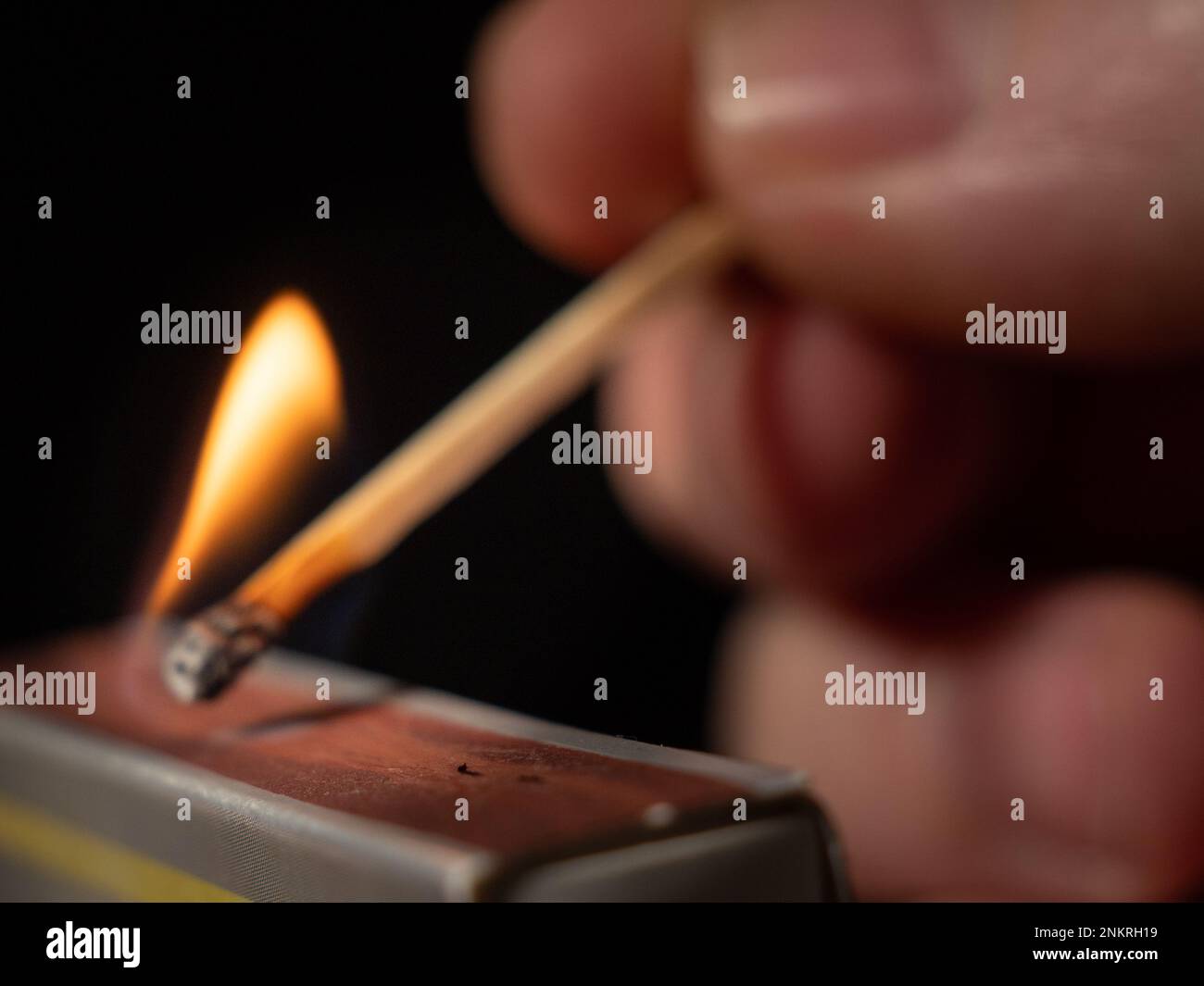 Burning match on a black background. Flame from a lit match. Close-up ...