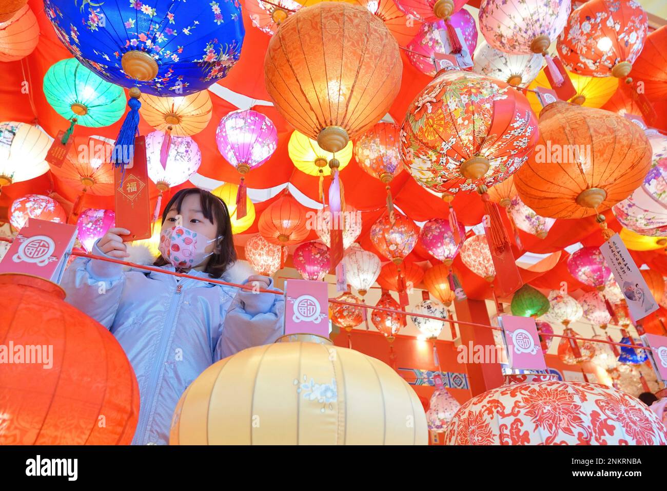 A maskclad girl tries to figure out the riddles attached to the